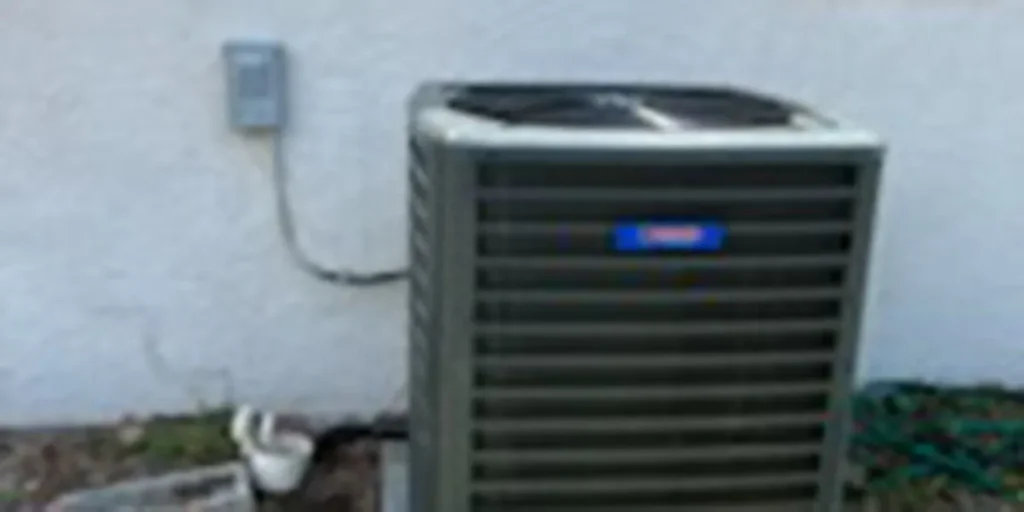 HVAC thermostat showing emergency heat