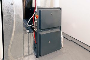 HVAC furnace unit installed in a home basement